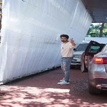 Anand Pandit Spotted Outside His Office With Varun Dhawan